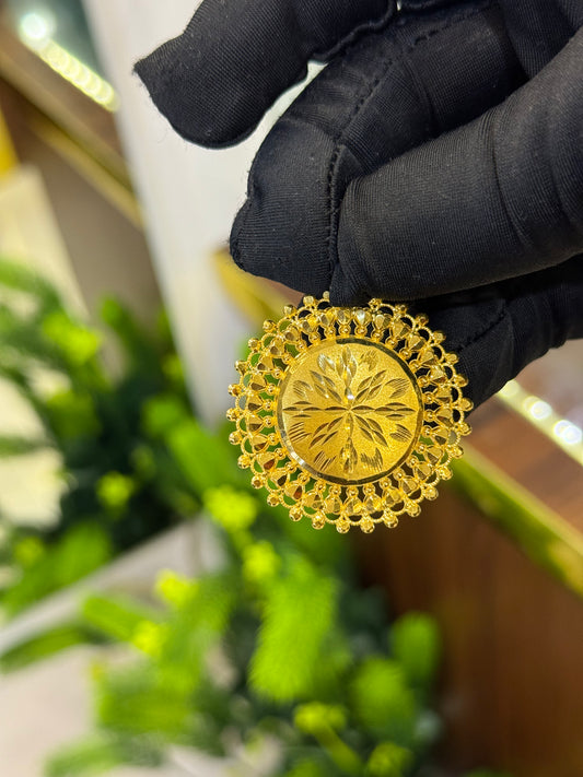 22-Karat Pendant.